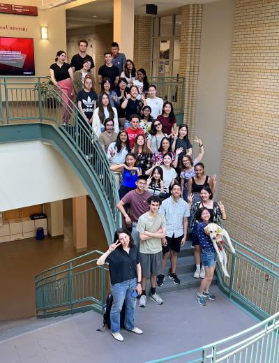 group photo of the 2022 summer researchers on the stairs in the NSH atrium