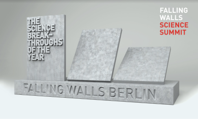 Falling Walls logo, 3 pieces of grey stone wall falling backwards