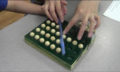 Researchers use a repurposed bingo tray to kid-test a mathematical concept.