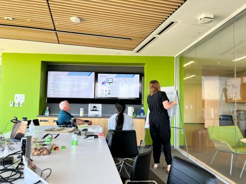 3 people participating in a workshop for gig workers and policymakers