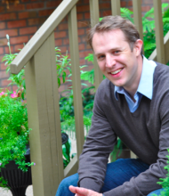 Steven Dow seated on steps outdoors