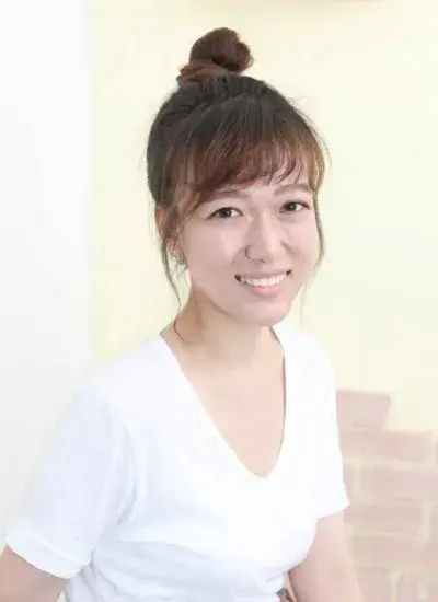 PhD Student Hyun Jin (Alicia) Lee in front of light colored background