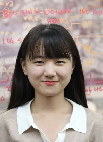 Photo of PhD Student Daehwa Kim in front of whiteboard