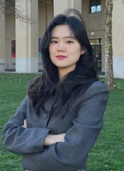 A photo of Min Park in front of a building on CMU campus
