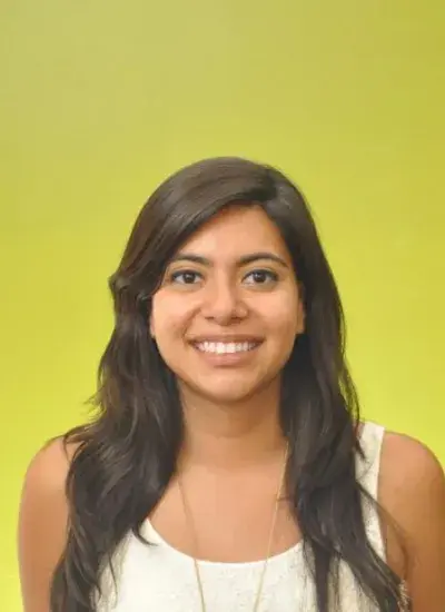 Rosina in front of the MHCI green wall 