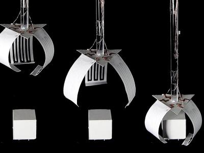 white paper actuators in front of black background