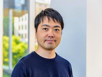 Hirokazu Shirado stands in hallway between Gates and NSH buildings
