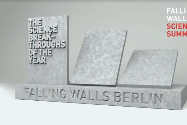 Falling Walls logo, 3 pieces of grey stone wall falling backwards