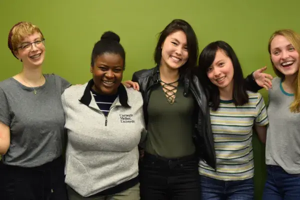 the 5 team members of the MedRespond team stand side by side in front of the MHCI green wall