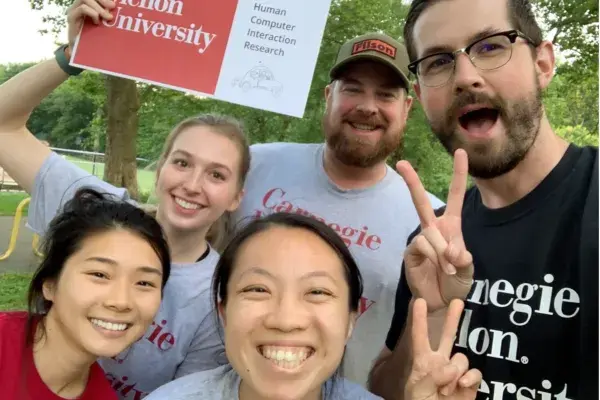 the 5 students on team 99P labs take a selfie outdoors