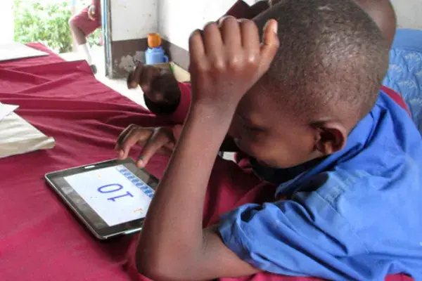 Child interacting with IPad