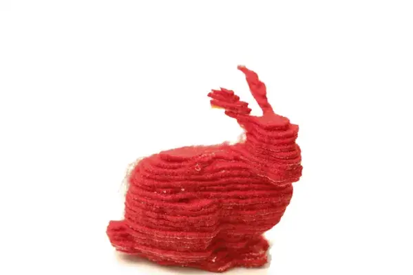 A small red bunny printed using layers of fabric.